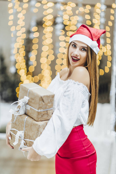 attractive woman with presents celebrating new year  - Fotó, kép
