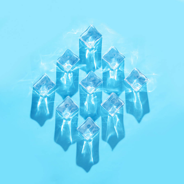 Ice cubes with pastel blue background - Photo, Image