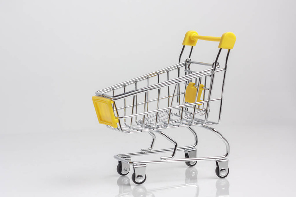 Shopping cart, shopping trolley isolated white background - Foto, immagini