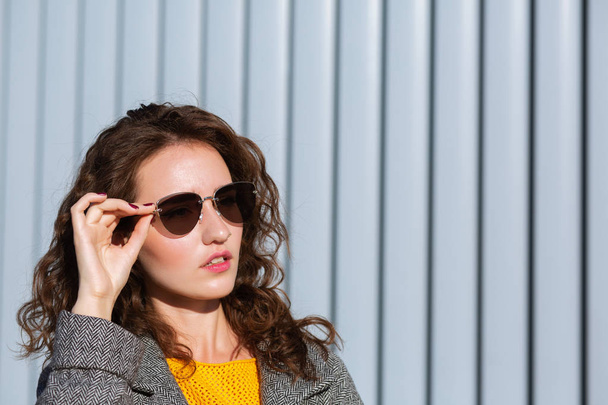 Closeup portrait of amazing girl wearing sunglasses and coat, po - Φωτογραφία, εικόνα