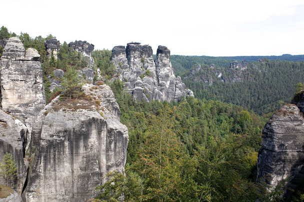 Landscape of rocks and forest in sunny day - Fotoğraf, Görsel