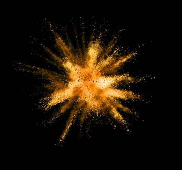Explosion of golden powder on black background - Foto, Imagem