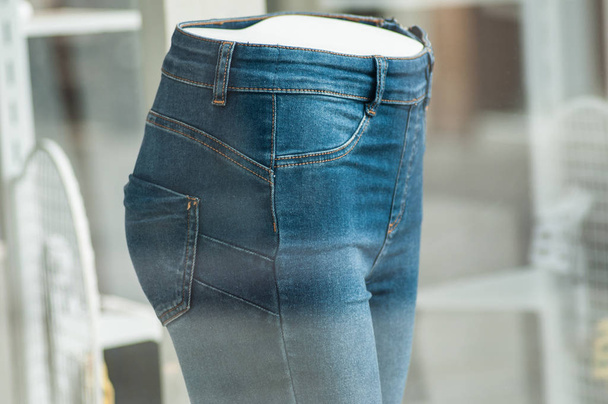 closeup of  elastic blue jeans on mannequin in women fashion sto - Photo, image