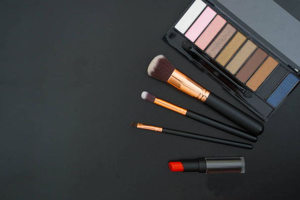 make up  and brushes  on black background - Foto, imagen