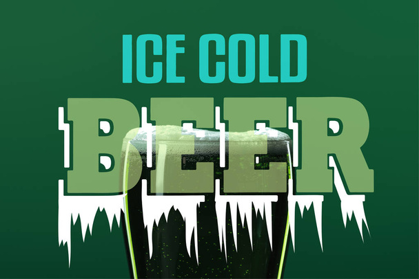 glass of beer with foam with ice cold beer lettering on green background - Foto, Imagen