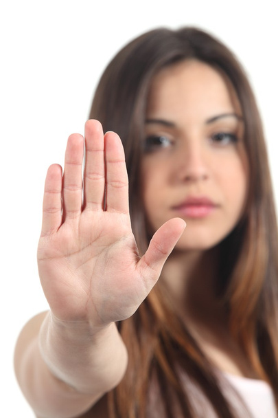 Mujer haciendo gesto de parada con su mano
 - Foto, imagen