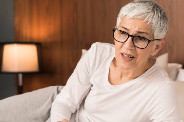 Worried anxious mature woman having problem falling asleep, Insomnia concept - Photo, Image