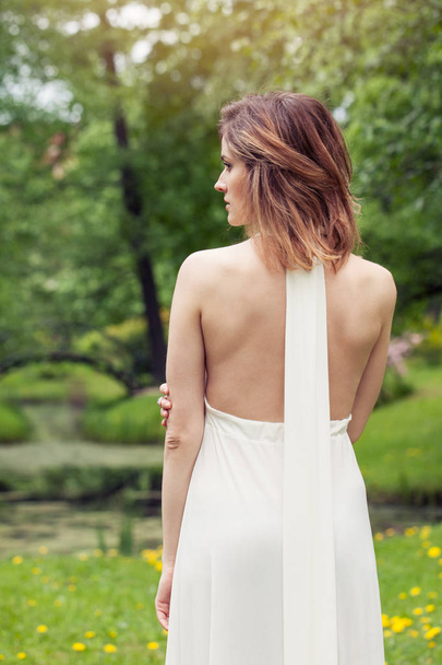 Spring outdoor portrait of stylish woman in white dress - Foto, Imagen