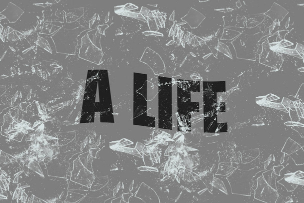Text life on broken glass, gray background. Concept of loss of interest in life, depression - Photo, Image