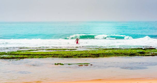 View on fisherman at the beach of Tangalle in Sri Lanka - Photo, Image