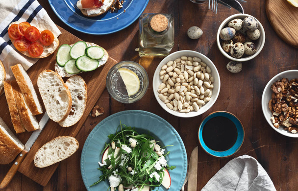 healthy breakfast lunch Various snacks appetizers arugula salad sandwiches prosciutto vegetables - 写真・画像