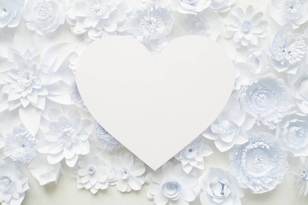 Heart from white paper flowers on white background - Foto, Imagem