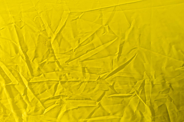 wrinkled yellow cloth as background - Photo, Image