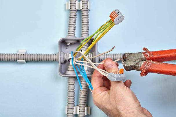 Electrician groups wires with pluggable connectors. - Photo, Image