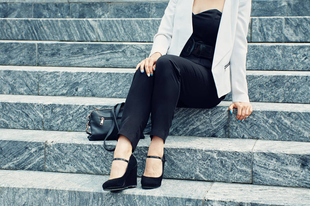 stylish woman in business suit with handbag - Valokuva, kuva