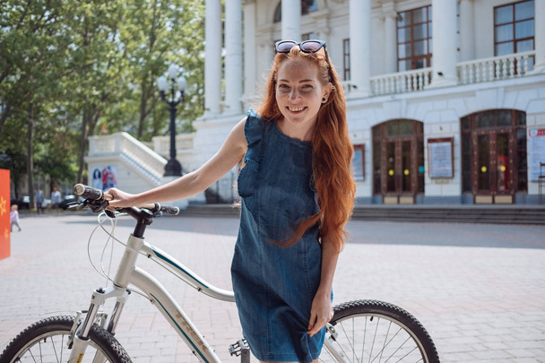 Beautiful woman riding on bike - Foto, immagini