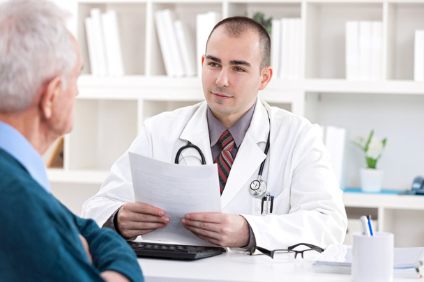 doctor talking with senior patient - Фото, изображение
