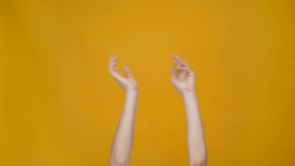 cropped view of woman snapping fingers and waving hands in air to rhythm of music - Imágenes, Vídeo
