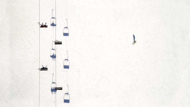Aerial view of ski elevator. One skier on the track. Flat lay. Concept - Foto, immagini