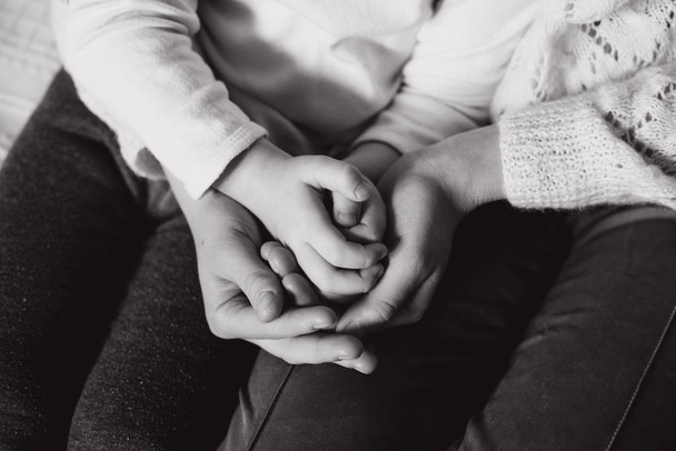 Close up view of family holding hands, loving caring mother supporting child, giving psychological support, help or protection - Fotografie, Obrázek