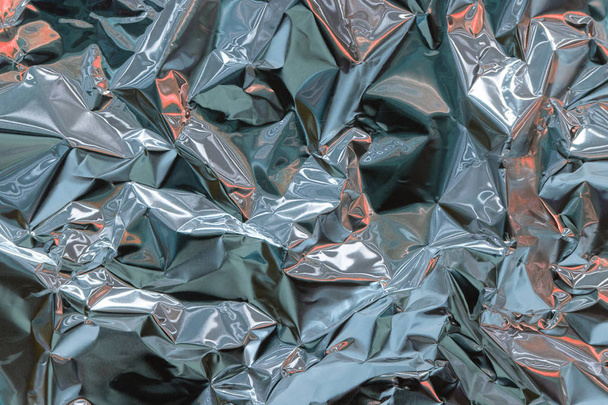 Holographische Textur zerknitterte Metallfolie. Hologramm abstrakte 80er Jahre - Foto, Bild