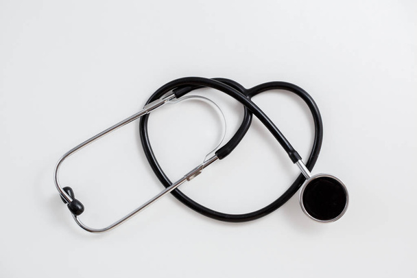 Concept for medicine. Vintage tonometer and stethoscope on white isolated background. View from above - Photo, image