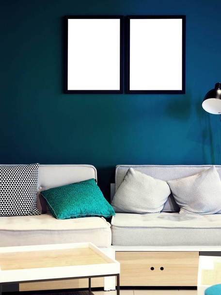 Mock-up, mockup exhibition, modern creative hipster living room, studio, office with sofa with pillows, couch and lamp, white empty photo frame on a solid color, green blue wall and white wooden desk - Foto, Imagem