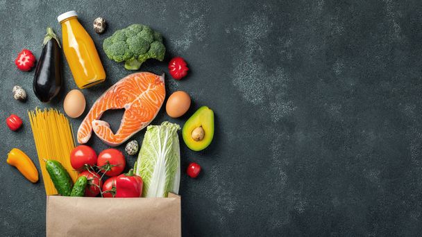 Supermarket. Paper bag full of healthy food. - Photo, Image