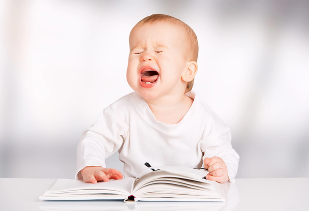funny baby reading a book and cries - Photo, Image