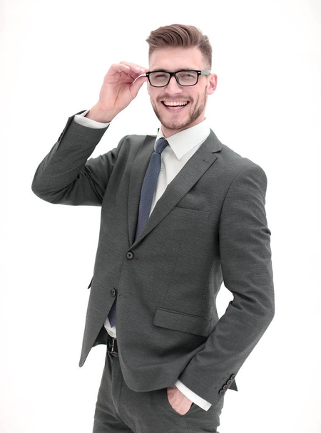 smiling businessman adjusting his glasses. - Foto, Bild