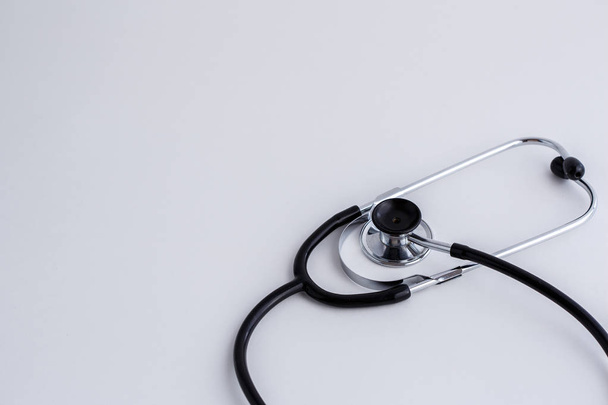 Concept for medicine. Vintage stethoscope on white isolated background. View from above - Foto, afbeelding