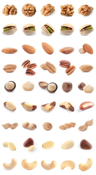 Set of different delicious organic nuts on white background  - Photo, Image
