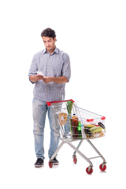 Young man with supermarket cart trolley on white - Photo, Image
