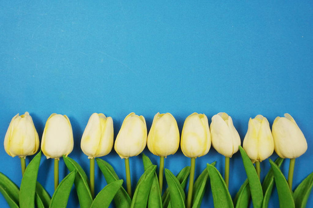 Empty space copy with tulip flower bouquet Top view on blue background - Zdjęcie, obraz