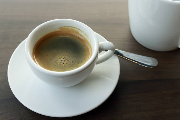 Hot coffee on wood background, black coffee. - Foto, imagen