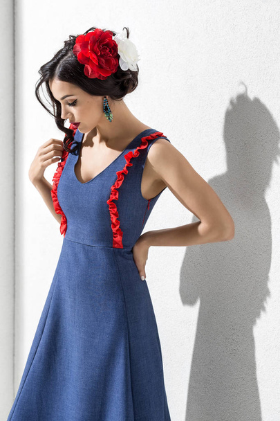 Brunette model in colorful dress and accessories posing in studio - Valokuva, kuva