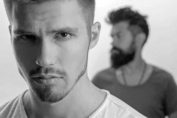 fashion men with unshaven beard. male grooming barber. man. Beard and facial care. facial emotions. Fashion portrait of man. serious and sad. unhappy people. sadness and depression. male friendship - Фото, зображення