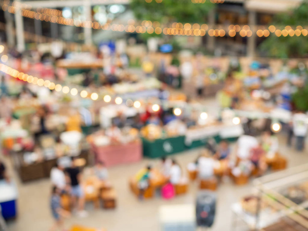 Blurred image of people in market of food festival - Photo, Image