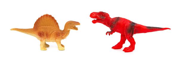 Beyaz arka plan üzerinde Tyrannosaurus ve spinosaurus oyuncaklar - Fotoğraf, Görsel