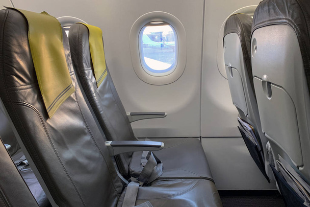 empty seats near the porthole in the plane - Photo, image