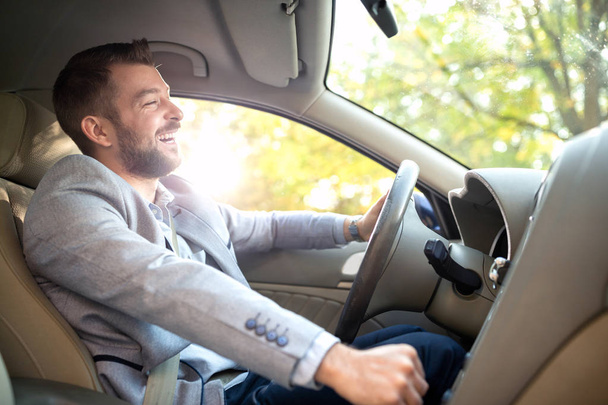 Smiling man in his car  - Фото, зображення