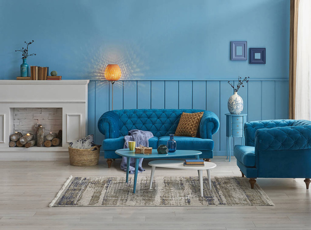 Blue sofa and wall concept, interior decoration with orange lamp, frame middle table style. - Photo, Image