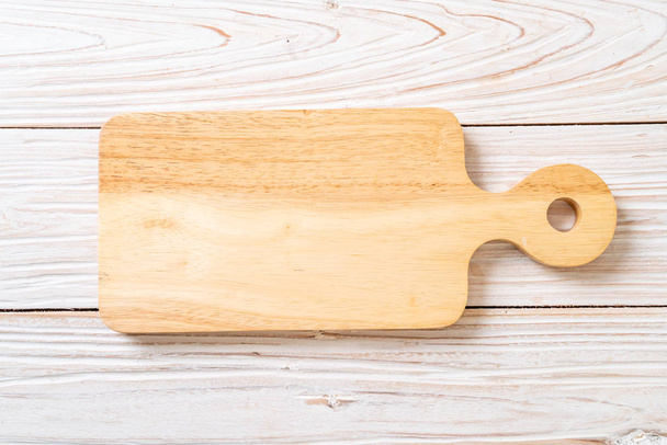 empty cutting wooden board with kitchen cloth - Fotó, kép