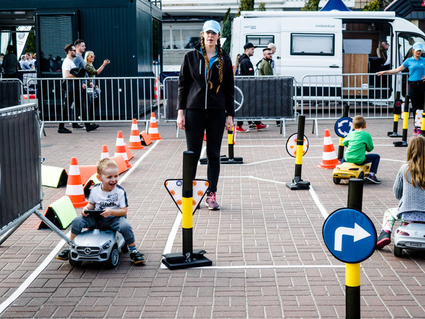 Poznan Motor Show 2018, 8 April 2018, Poznan, Poland, Little children training on traffic playground, Small traffic for kids learning street rules. Driving school practice circuit. - Fotó, kép