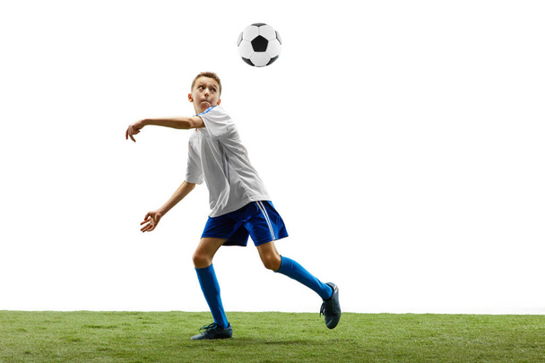 Young boy with soccer ball isolated on white. football player - Фото, изображение