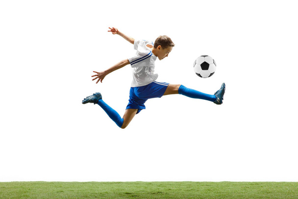 Young boy with soccer ball isolated on white. football player - Foto, imagen