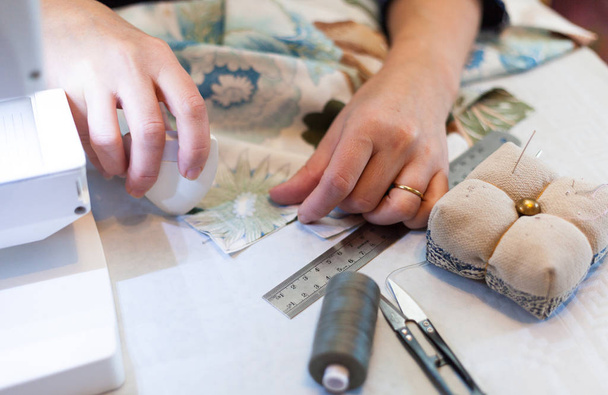 Seamstress hands at work, threads and needles - Φωτογραφία, εικόνα