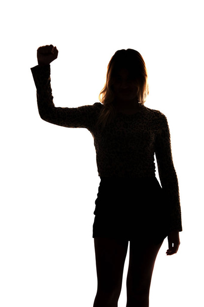 chica revolucionaria con el brazo en alto - Foto, Bild