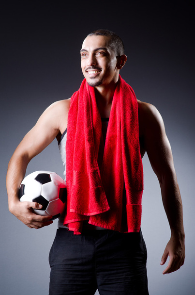 Football player with ball and towel - Фото, зображення