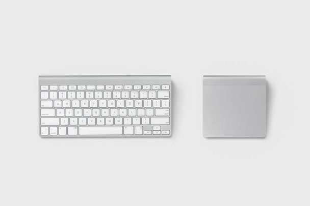 Wireless computer keyboard and trackpad isolated on soft gray background. - Foto, imagen